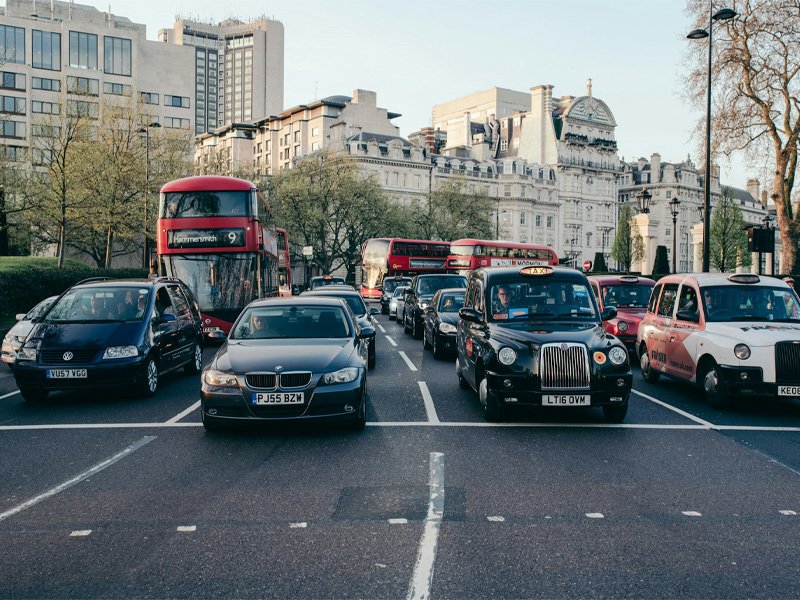 Cars waiting at a junction in London, driving on the left